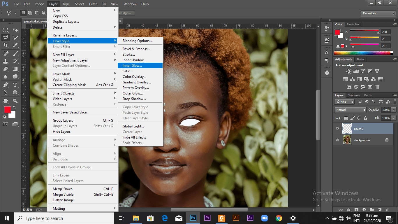 Selecting the option of "inner glow" from the "layer style" option from "layers"