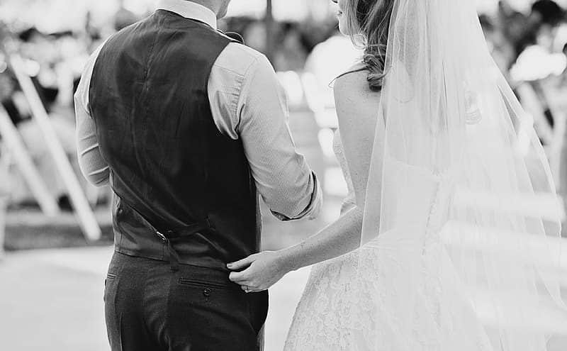 grayscale-photography-of-couple-in-wedding-dress-and-suit-6052659